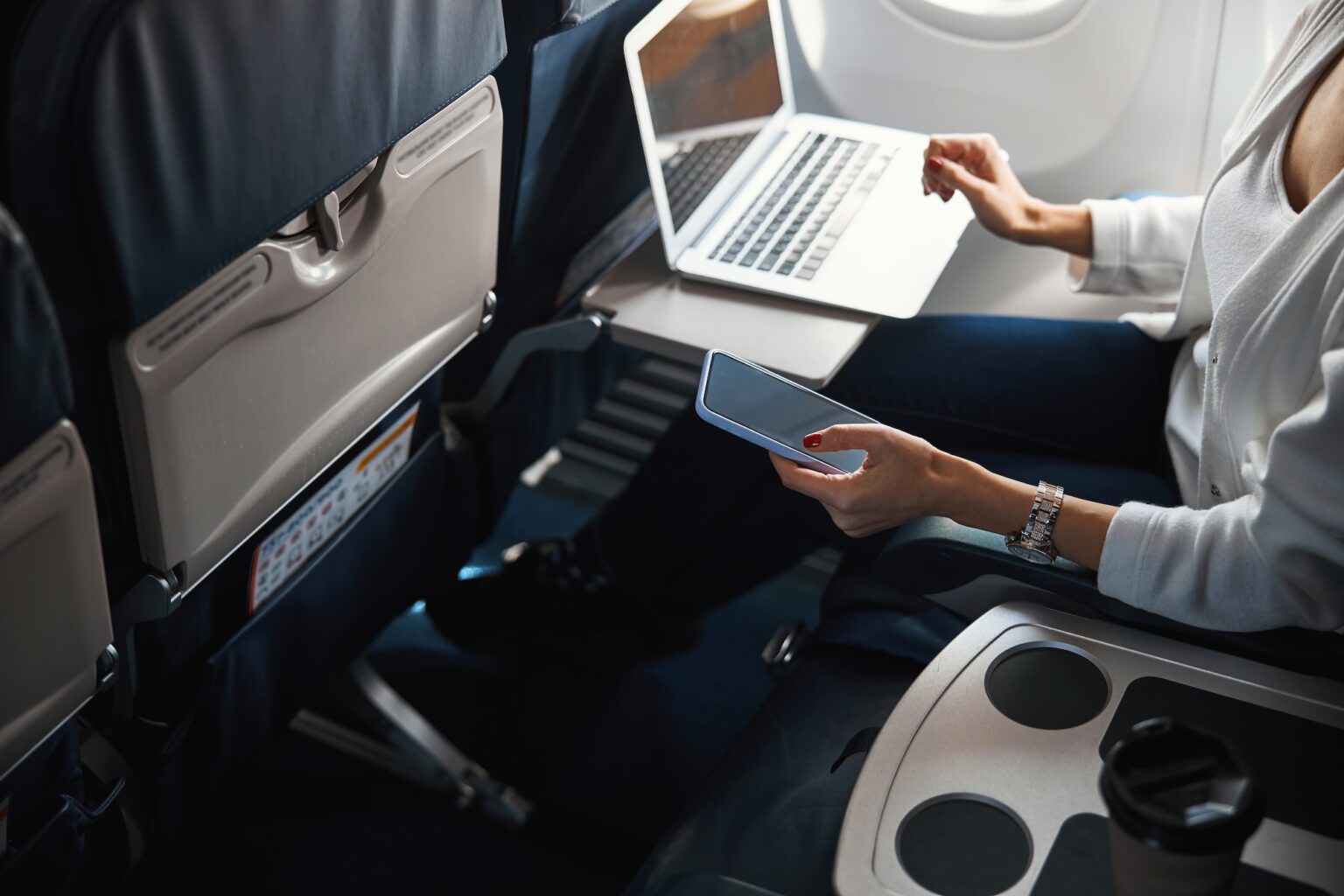 Unrecognized female passenger using the Internet in the plane
